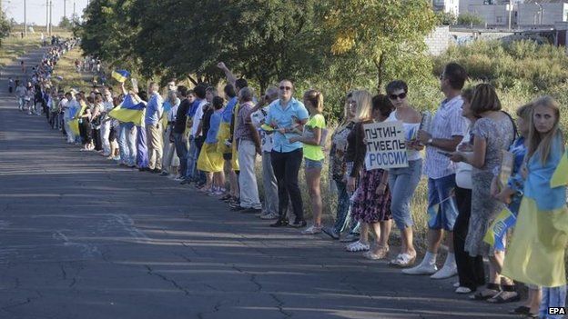 Residents of Mariupol form a human chain to protest against Russia's actions, 30 Aug