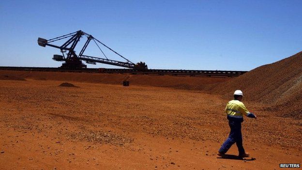 A worker at the Fortescue loading dock located at Port Hedland in the Pilbara region of Western Australia in this 3 December 2013 file photo