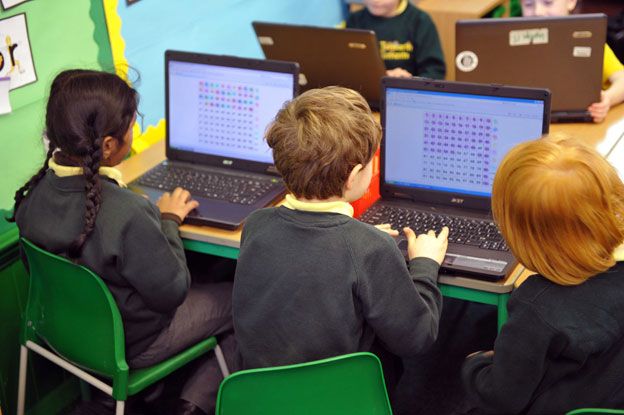 Primary school children on computers