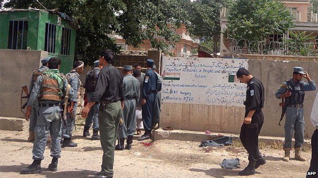 File photo: Afghan policemen stand at the site of a suicide bombing in front of the provincial council building in the city of Pul-e-Khumri, capital of northern Baghlan province, 20 May 2013