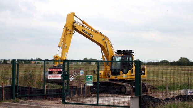 A digger on the proposed Wrexham prison site