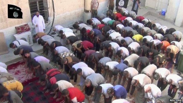 Image published by Islamic State purportedly showing Yazidi men converting to Islam (21 August 2014)