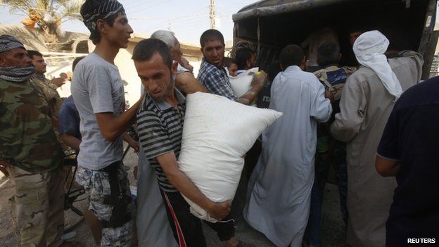 Amerli residents receive aid from a Kurdish political party - 1 September