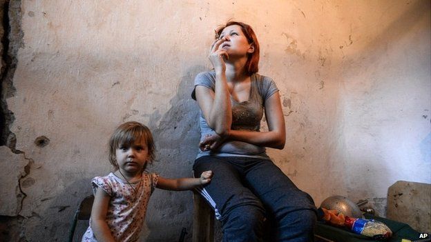 A mother and child hide in a bomb shelter in Petrovskiy district in Donetsk, eastern Ukraine - 1 September 2014