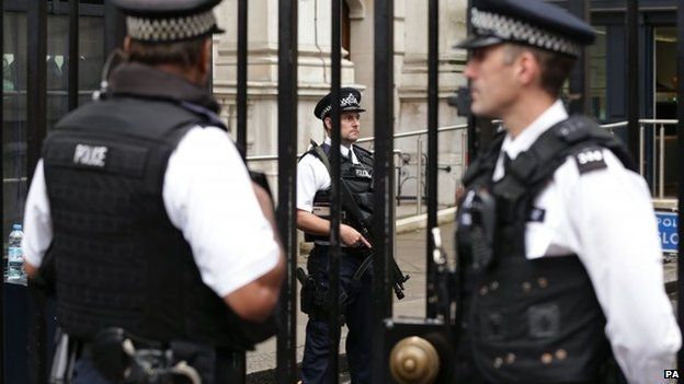 Armed police officers on duty at Downing Street, London
