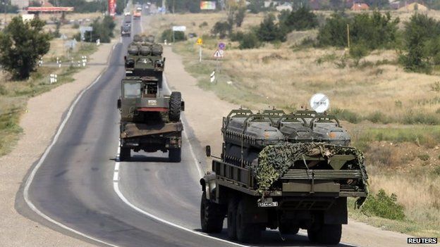 Russian military vehicles drive along the road outside Kamensk-Shakhtinsky, Rostov region, Russia, 16 August 2014