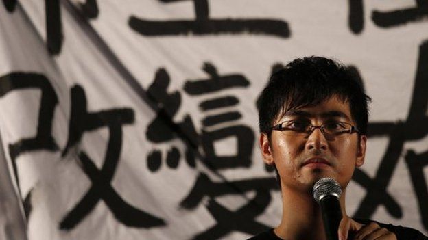 Alex Chow, secretary-general of the Hong Kong Federation of Students, speaks during a campaign to kick off the Occupy Central civil disobedience event in front of the financial Central district in Hong Kong 31 August 2014.