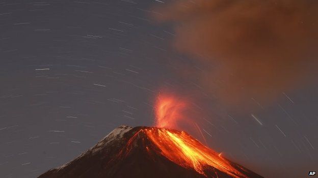 The Tungurahua volcano throws ash and stones during an eruption seen from Banos, Ecuador on 31 August, 2014.