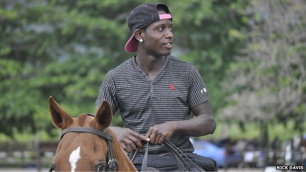 Young trainer on a polo pony