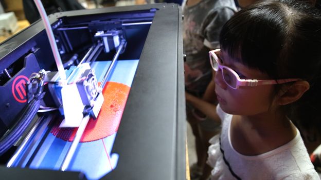 Chinese girl learning how to use a 3-D printer in a workshop at Creatica in Beijing