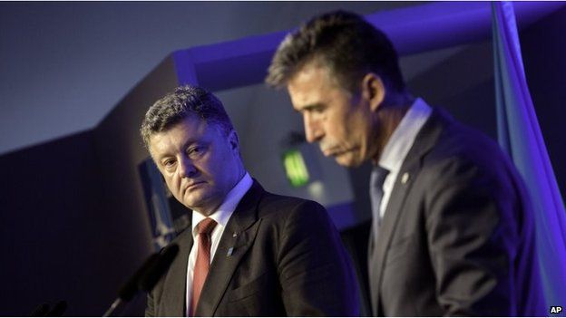 Ukrainian President Petro Poroshenko, left, and NATO Secretary General Anders Fogh Rasmussen participate in a media conference during a NATO summit at the Celtic Manor Resort in Newport, Wales on Thursday, Sept. 4,
