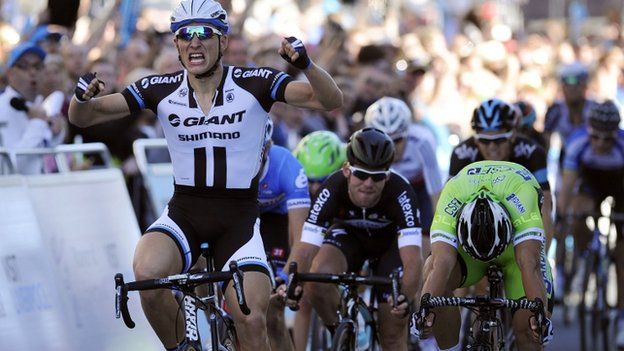 Marcel Kittel (left) celebrates as he wins the opening stage of the Tour of Britain with Mark Cavendish(centre) back in third place during the stage one of the 2014 Tour of Britain.
