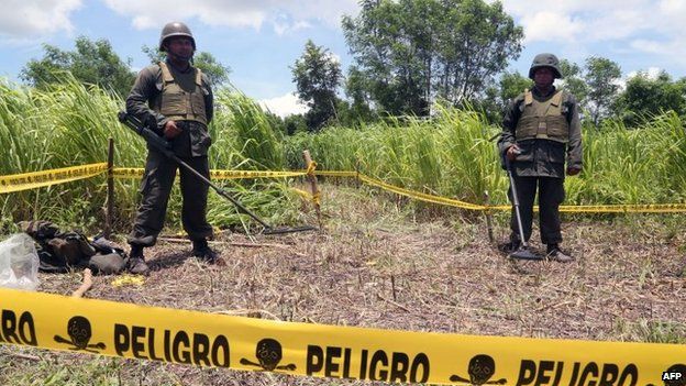 Nicaraguan soldiers standing guard in the site where a meteorite struck on 7 September, 2014 in Managua
