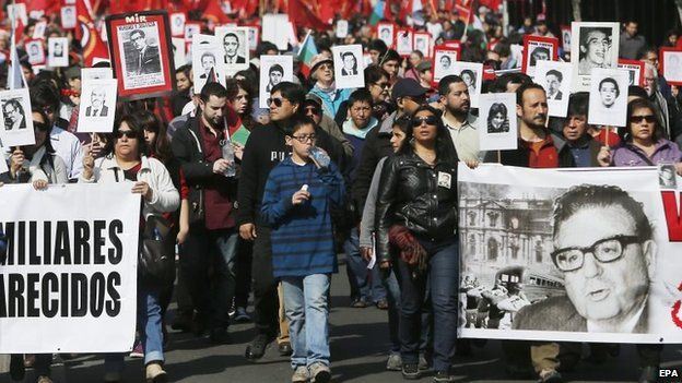 Chileans march to the memorial of "The Disappeared-Detained" at General Cemetery on 7 September 2014.