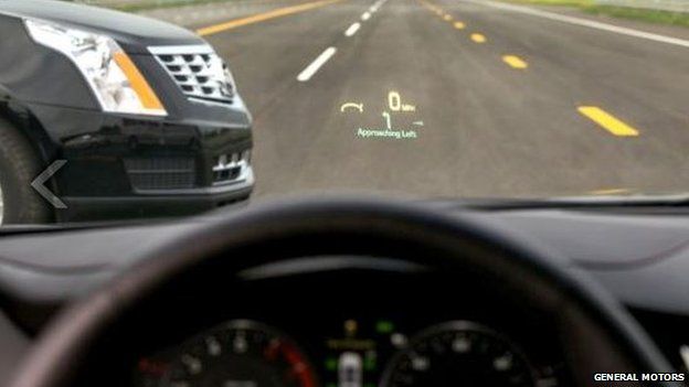 View out of the front of the windscreen of a Cadillac with other oncoming vehicle