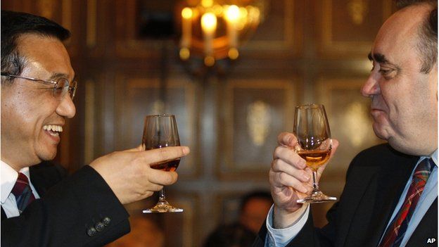 In this 9 Jan 2011 file photo China's Vice Premier Li Keqiang, left, laughs as he raises a glass of whisky to Scotland's First Minister Alex Salmond before attending a state dinner at Edinburgh castle in Edinburgh, Scotland.