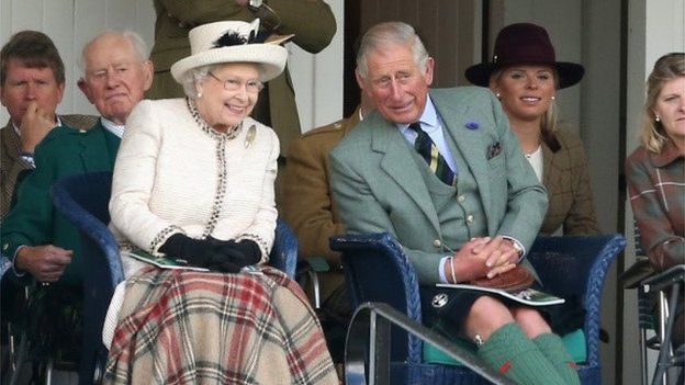 Queen Elizabeth II and Prince Charles, Prince of Wales watch the Braemar Highland Games 2014