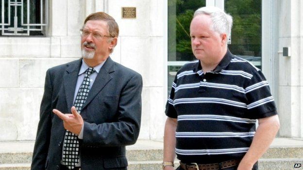 William Melchert-Dinkel, right, and his attorney Terry Watkins leave court in Faribault, Minnesota 8 August 2014