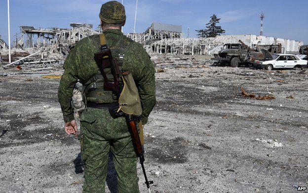 Rebel soldier and devastated Luhansk airport, 11 Sep 14