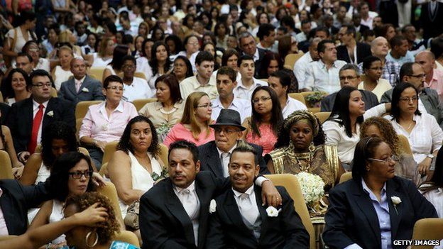 Gay couples wait to marry in large communal gay wedding in Rio