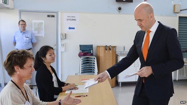 Sweden's Prime Minister and leader of the Moderate Party, Fredrik Reinfeldt casts his ballot at a polling station in the Stockholm suburb of Taeby.