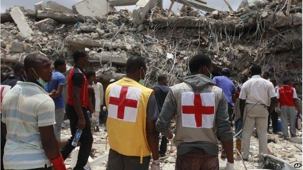 Rescue workers search for survivors in the rubble of a collapsed building belonging to the Synagogue Church of All Nations in Lagos on Saturday, 13 September.