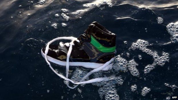 A shoe belonging to an illegal immigrant floats on the water after a boat carrying illegal migrants sank off Libya