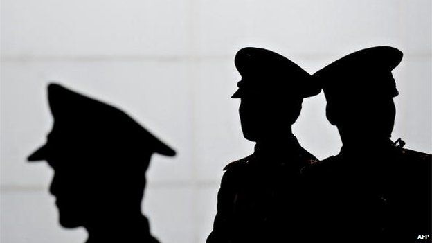 PLA soldiers stand guard at a metro station as visitors arrive at the site of the World Expo 2010 in Shanghai on 20 April 2010.