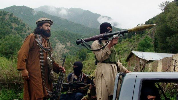 Pakistani Taliban patrol in their stronghold of Shawal in Pakistani tribal region of South Waziristan.