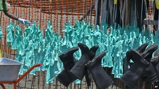 Gloves and rubber boots forming part of the Ebola prevention gear for health workers drying in the sun in Monrovia, Liberia, on 8 September 2014.