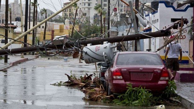 Picture of a street in Cabo San Lucas taken after hurricane Odile knocked down trees and power lines in this city in Mexico's Baja California peninsula, 15 September 2014