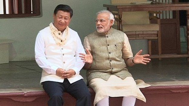 Mr Xi (left) wore a traditional Indian jacket gifted to him by Mr Modi (right) on Wednesday