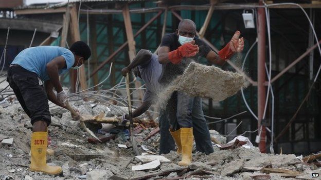 Rescue workers search for survivors in the rubble of a collapsed building belonging to the Synagogue Church of All Nations in Lagos, Nigeria, Tuesday 16 September 2014