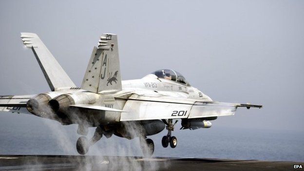 US Navy F/A-18 Hornet takes off from USS George HW Bush - 15 August