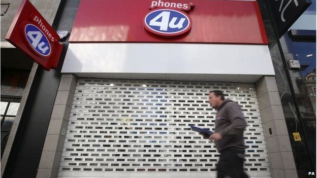 File photo dated 15/09/14 of a Phones 4U shop in Oxford Street in central London with its shutters down.