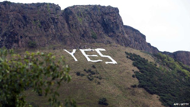 Pro-independence campaigners placed a huge "Yes" sign underneath Salisbury Crags in Edinburgh