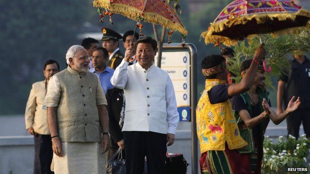 Mr Xi (left) wore a traditional Indian jacket gifted to him by Mr Modi (right) on Wednesday