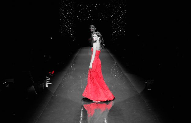 Model in red dress on catwalk