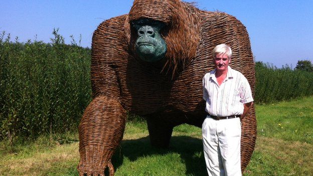 Sculptor Robert Yates with the wicker gorilla
