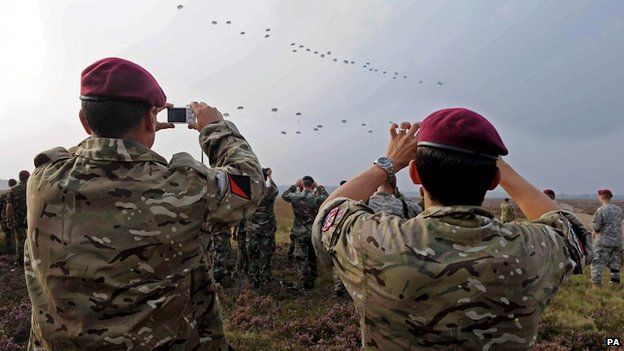 Ministry of Defence of soldiers from the Parachute Regiment taking pictures of the parachute drop