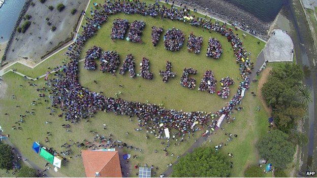 An image captured from a drone shows protesters forming the words "Beyond Coal + Gas" during a demonstration in Sydney - 21 September 2014