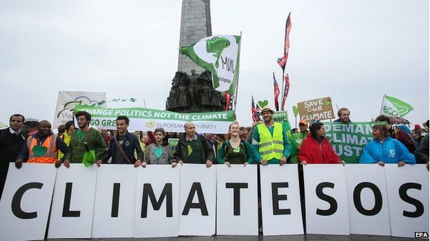 Protesters march to demand urgent action on climate change in Brussels, Belgium - 21 September 2014