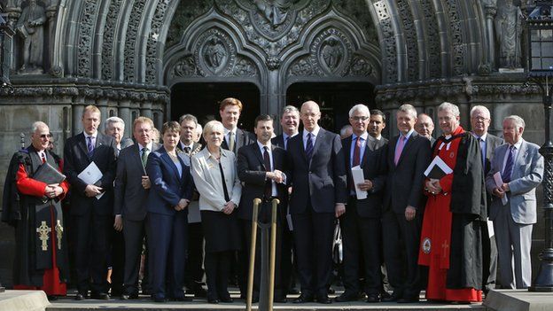 Labour"s shadow foreign secretary Douglas Alexander (centre left) shakes hands with SNP Finance Secretary John Swinney (centre right) with other representatives of political parties and the church