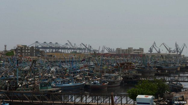 Fishing boats are moored near a naval dockyard in Pakistan"s port city of Karachi on September 9, 2014