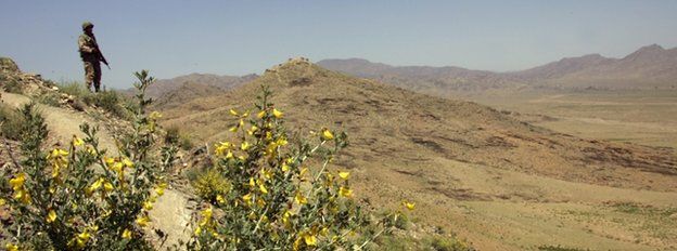 A Pakistani army soldier guards a hilltop position at a military outpost near Wana April 11, 2007 in Pakistan"s South Waziristan tribal area near the Afghan border