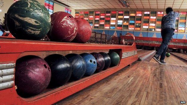 A man bowls in the Asmara bowling alley in Asmara, the capital of Eritrea, on 20 July 2013