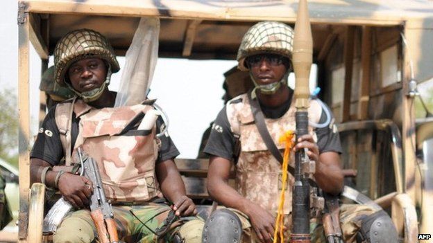 Nigerian soldiers ready for a patrol in the north of Borno state on 5 June 2013 in Maiduguri, Nigeria