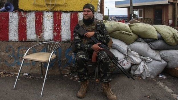 A Ukrainian serviceman at a checkpoint near Debaltseve in east Ukraine