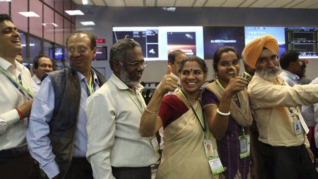 Indian Space Research Organisation scientists and officials cheer as they celebrate the success of Mars Orbiter Mission