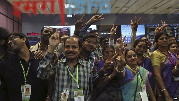 Indian Space Research Organization scientists and other officials cheer as they celebrate the success of Mars Orbiter Mission